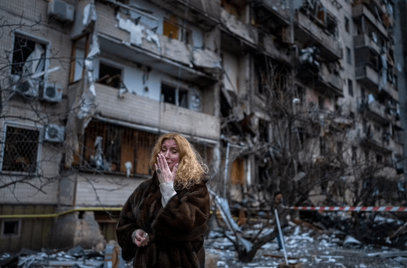 Natali Sevriukova, a Kyiv resident, is seen sobbing on the streets after a Russian rocket demolished her apartment building overnight.