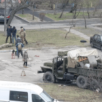 Video Ukrainian army preparing to meet Putin's troops today INSIDE Kyiv: Fearful residents are instructed to construct Molotov cocktails to defend themselves.